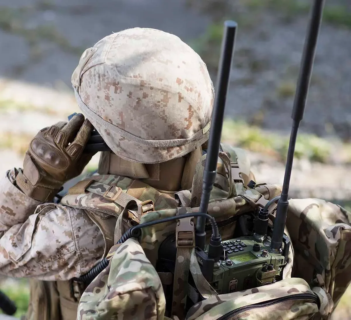 Soldier operating a secure field radio