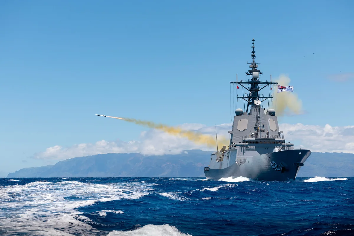 Naval warship firing a missile at sea