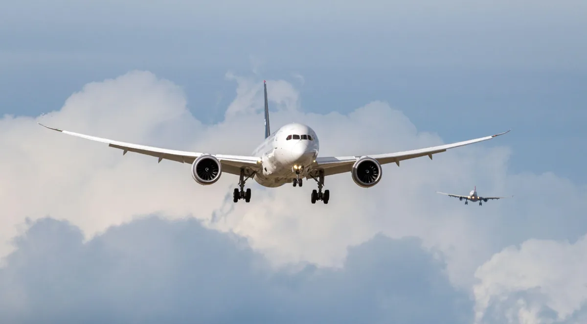 Passenger aircraft climbing through cloud